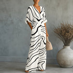 Solene V-Ausschnitt Jumpsuit mit weitem Bein und gebundener Taille