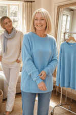 Zopfmuster Rundhals Strickpullover mit Blumendetails am Saum