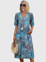 Florales Bohemian Midikleid mit V-Ausschnitt und Taschen