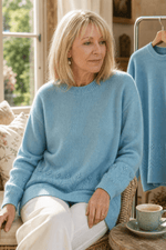 Zopfmuster Rundhals Strickpullover mit Blumendetails am Saum